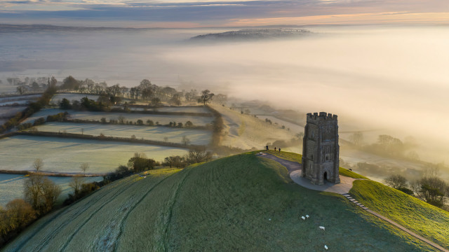 Tower fog hill trees field free wallpaper - medium preview image