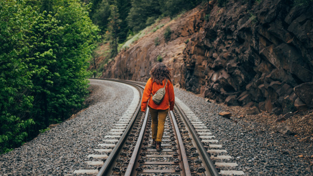 Woman traintracks woods backpack tiltshift free wallpaper - medium preview image