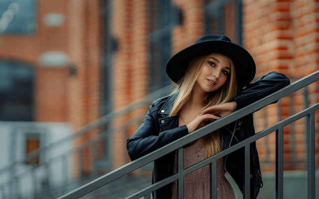 Woman blackhat jacket brickwall portrait free wallpaper - medium preview image