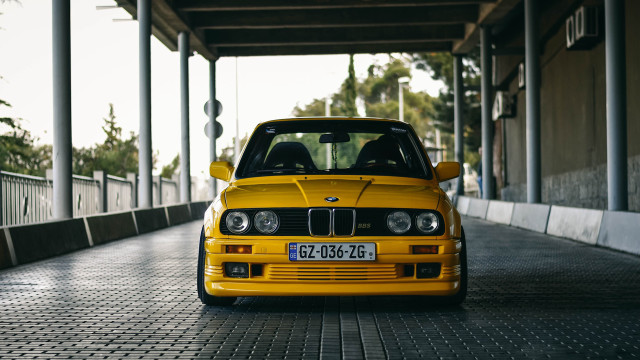 Yellow car parking garage white free wallpaper - medium preview image