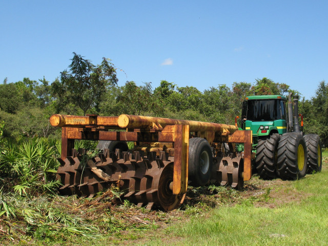 Tractor parked field plow attached free wallpaper - medium preview image