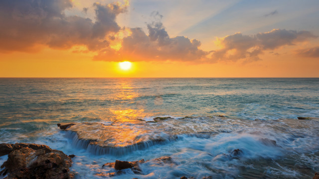 Sunset ocean waves rocks clouds free wallpaper - medium preview image