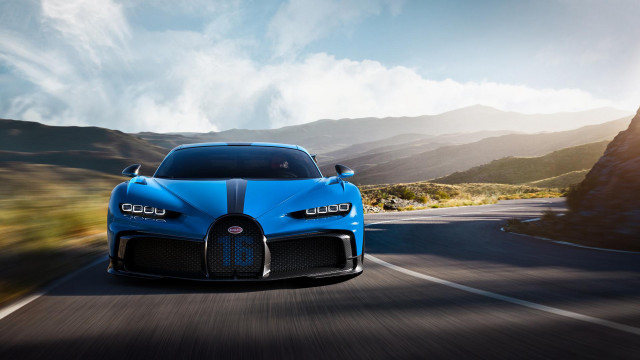 Blue bugatti mountains clouds sunset free wallpaper - medium preview image