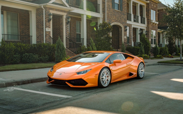 Bright orange sports car residential free wallpaper - medium preview image