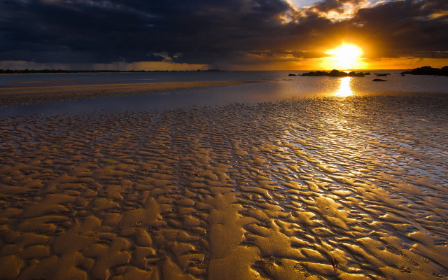 Sunset beach footprints clouds water free wallpaper - medium preview image