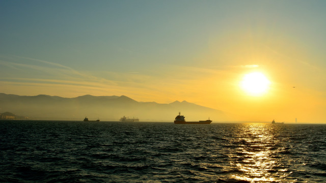 Sunset boat mountain ocean lake free wallpaper - medium preview image
