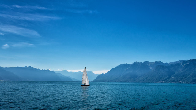 Sailboat mountains blue sky clouds free wallpaper - medium preview image