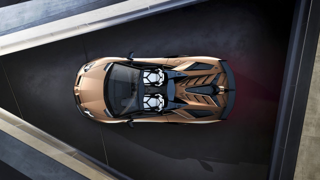 Gold sports car above parking free wallpaper - medium preview image