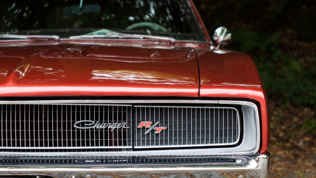 Red car wooded area photorealism free wallpaper - medium preview image