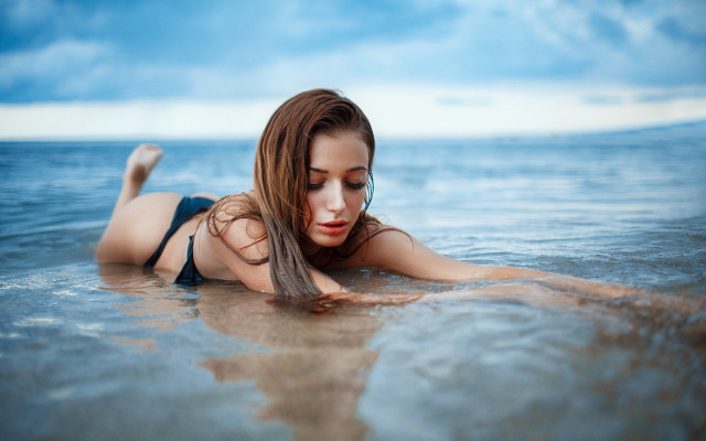 Woman water bikini jeans laying free wallpaper - medium preview image
