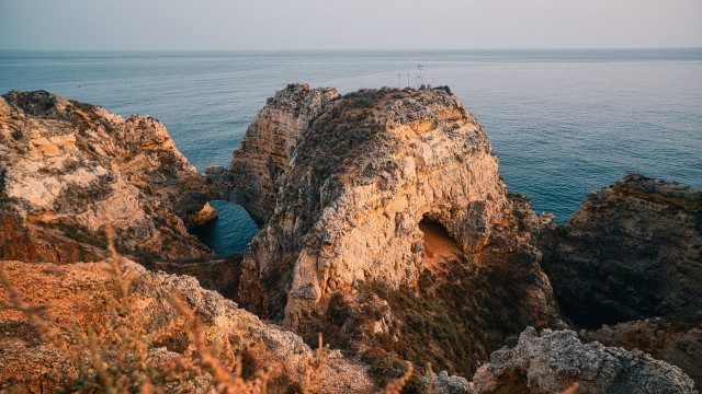 Rocky cliff hole ocean shore free wallpaper - medium preview image
