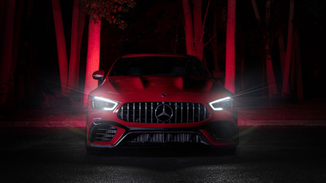 Red car glowing dark headlights free wallpaper - medium preview image