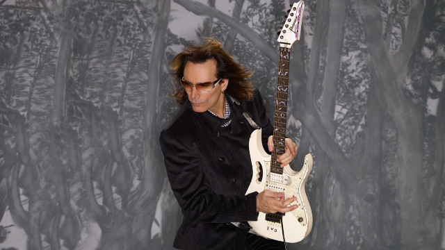 Black suit man white guitar free wallpaper - medium preview image