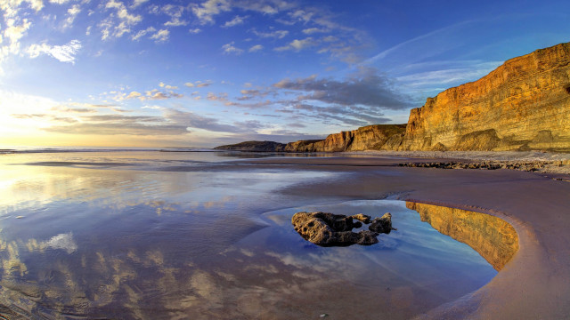 Rock water beach clouds mountains free wallpaper - medium preview image
