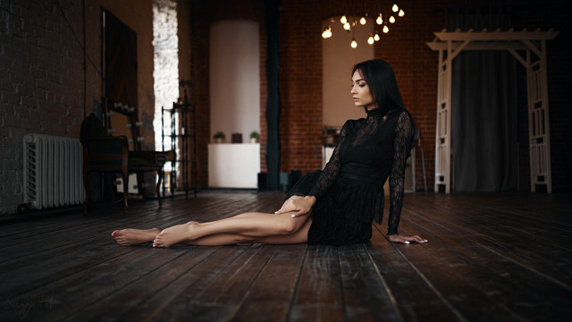 Woman sitting dark room brick free wallpaper for desktop - medium preview image