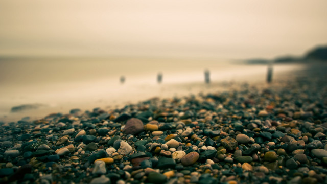 Beach rocks gravel water people free wallpaper - medium preview image