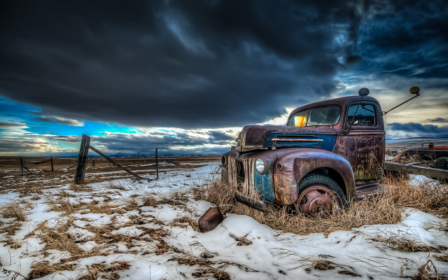 Old truck snowy field cloudy free wallpaper - medium preview image