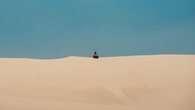 Desert quad rider blue sky free wallpaper - medium preview image