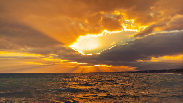 Sunset ocean boat clouds sunbeams free wallpaper - medium preview image