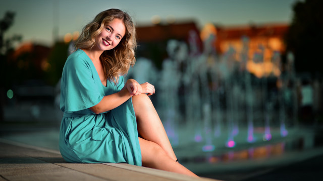 Woman sitting fountain city smile free wallpaper - medium preview image