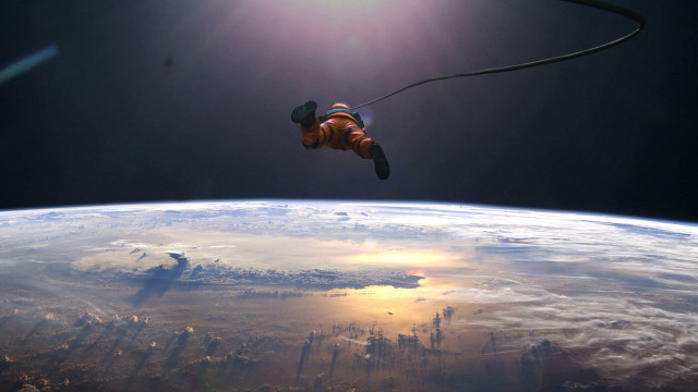 Man red suit space earth free wallpaper - medium preview image