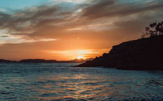 Sunset water island clouds cityscape free wallpaper - medium preview image