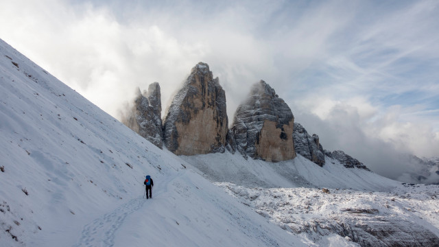 Hiking man snowy mountain clouds free wallpaper - medium preview image