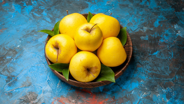 Yellow apples bowl blue surface free wallpaper - medium preview image