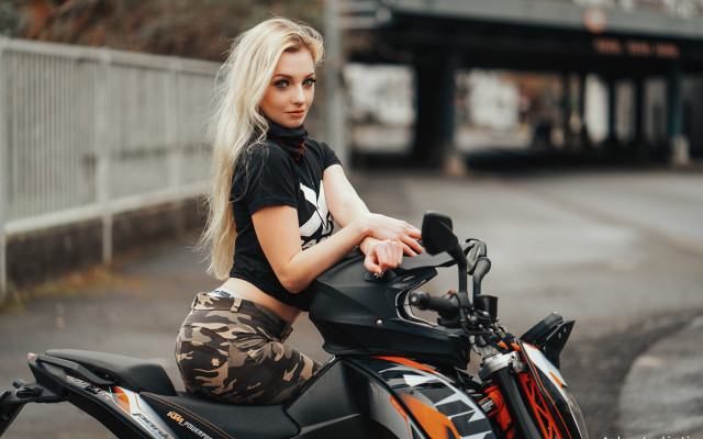Woman motorcycle sitting bokeh blurry free wallpaper - medium preview image