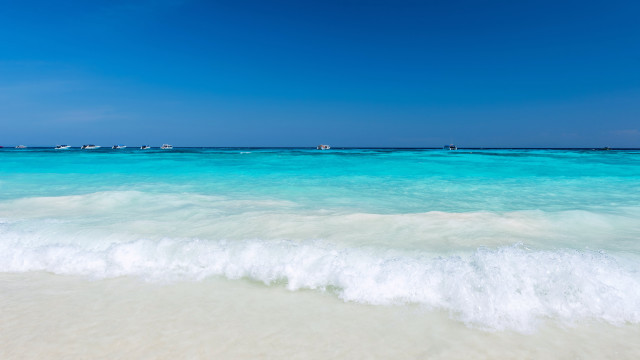 Beach waves boats sky lighthouse free wallpaper - medium preview image