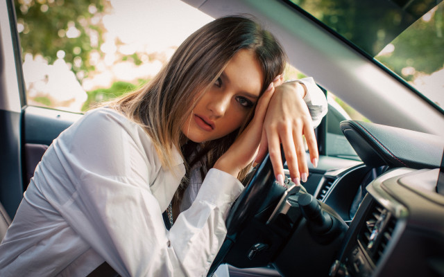 Woman car blurry depthoffield longhair free wallpaper - medium preview image
