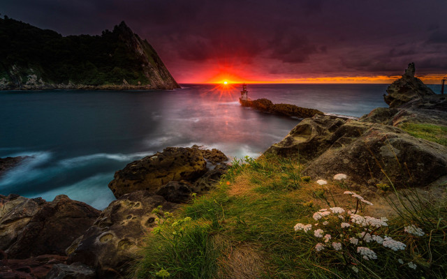 Sunset rocky beach boat mountain free wallpaper - medium preview image