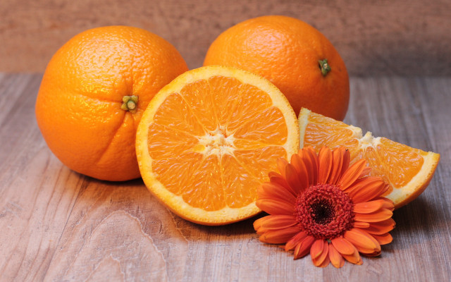 Orange flower slice on table free wallpaper for desktop - medium preview image