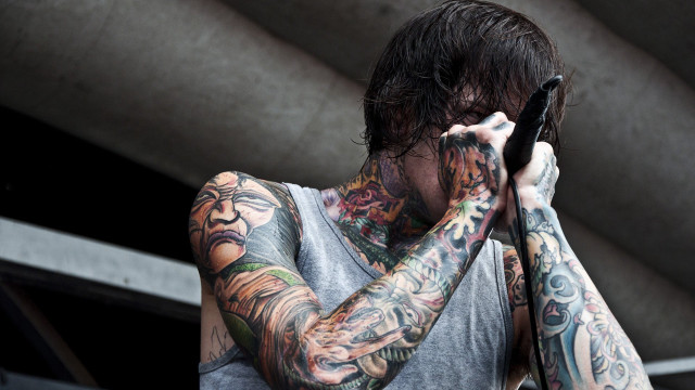 Man tattoos cellphone covering eyes free wallpaper - medium preview image