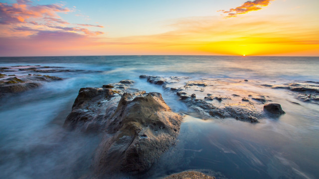 Sunset ocean rocks orange sky free wallpaper - medium preview image