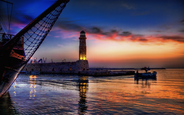 Lighthouse sunset mystical boat water free wallpaper - medium preview image