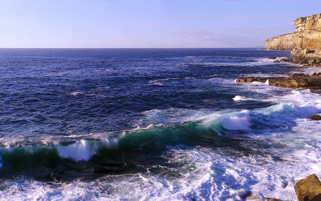 Ocean waves cliff sky city free wallpaper - medium preview image