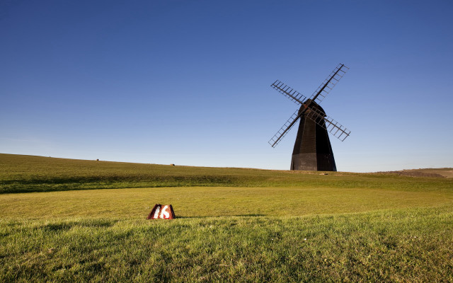 Windmill field person tiltshift sunset free wallpaper - medium preview image
