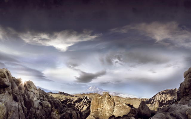 Mountain landscape rocks cloudy sky free wallpaper - medium preview image