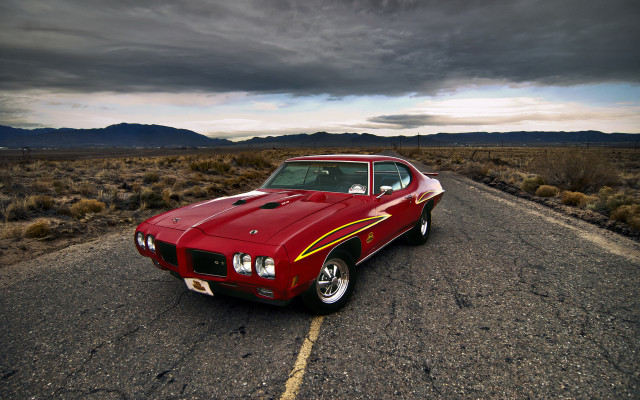 Red car desert mountains cloudy free wallpaper - medium preview image