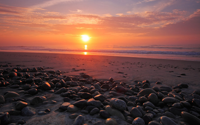 Sunset beach rocks water person free wallpaper - medium preview image