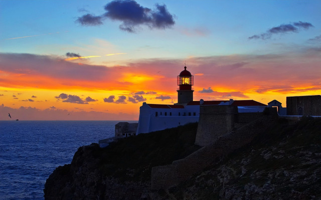 Lighthouse cliff sunset bird magical free wallpaper - medium preview image
