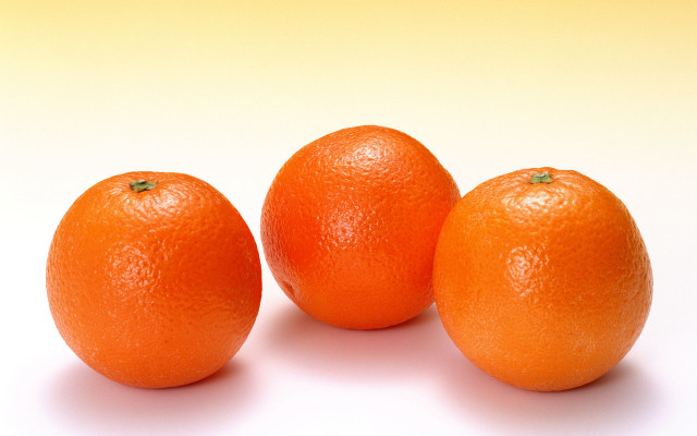 Three oranges white surface yellow free wallpaper - medium preview image