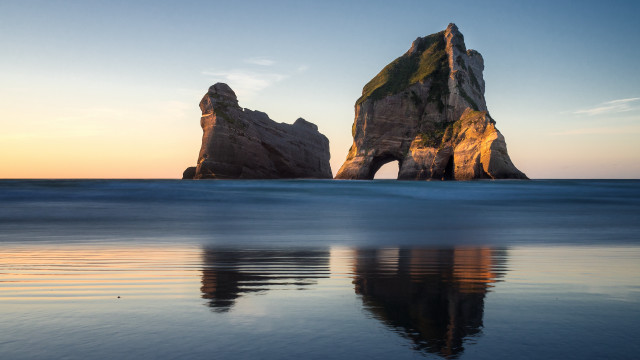 Rock formation reflection ocean sky free wallpaper - medium preview image