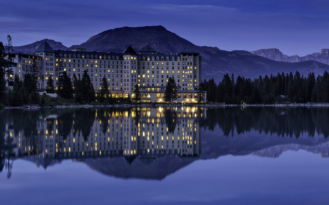 Large building lake mountains night free wallpaper - medium preview image