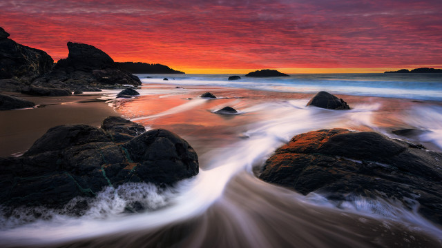Sunset beach rocks water mountains free wallpaper - medium preview image