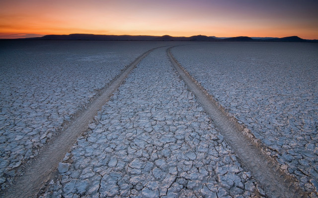 Desert sunset tracks mountains clouds free wallpaper - medium preview image