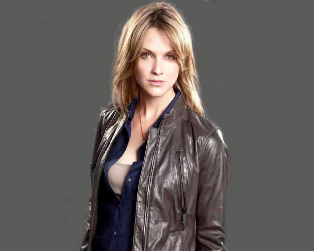 Woman leather jacket posing hands free wallpaper - medium preview image
