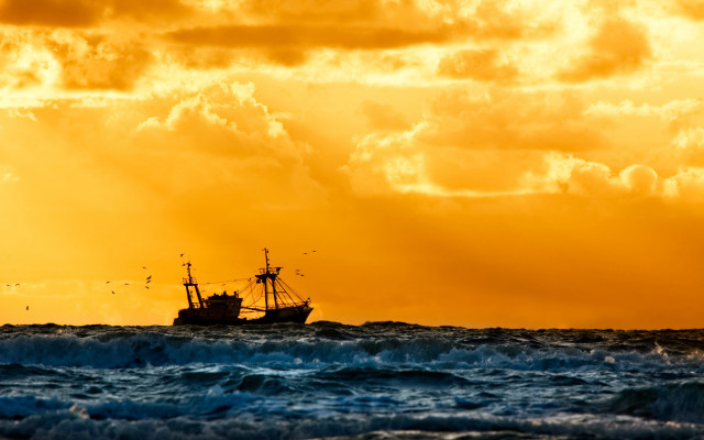 Boat ocean yellow sky clouds free wallpaper - medium preview image
