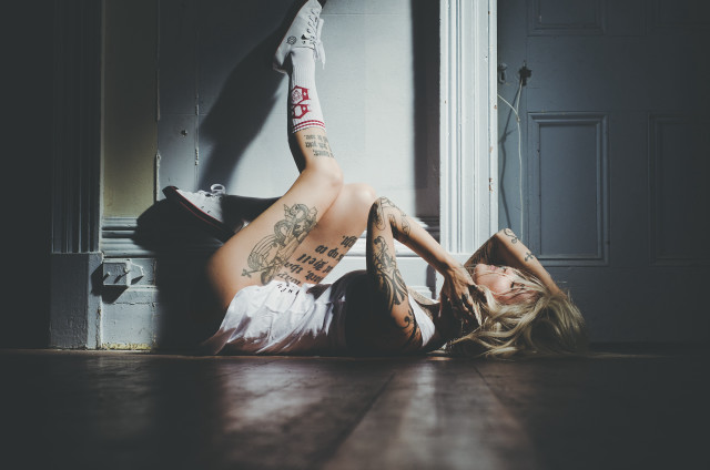 Woman sitting tattooed back legs free wallpaper - medium preview image